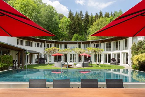 architectural photo with pool and dining area